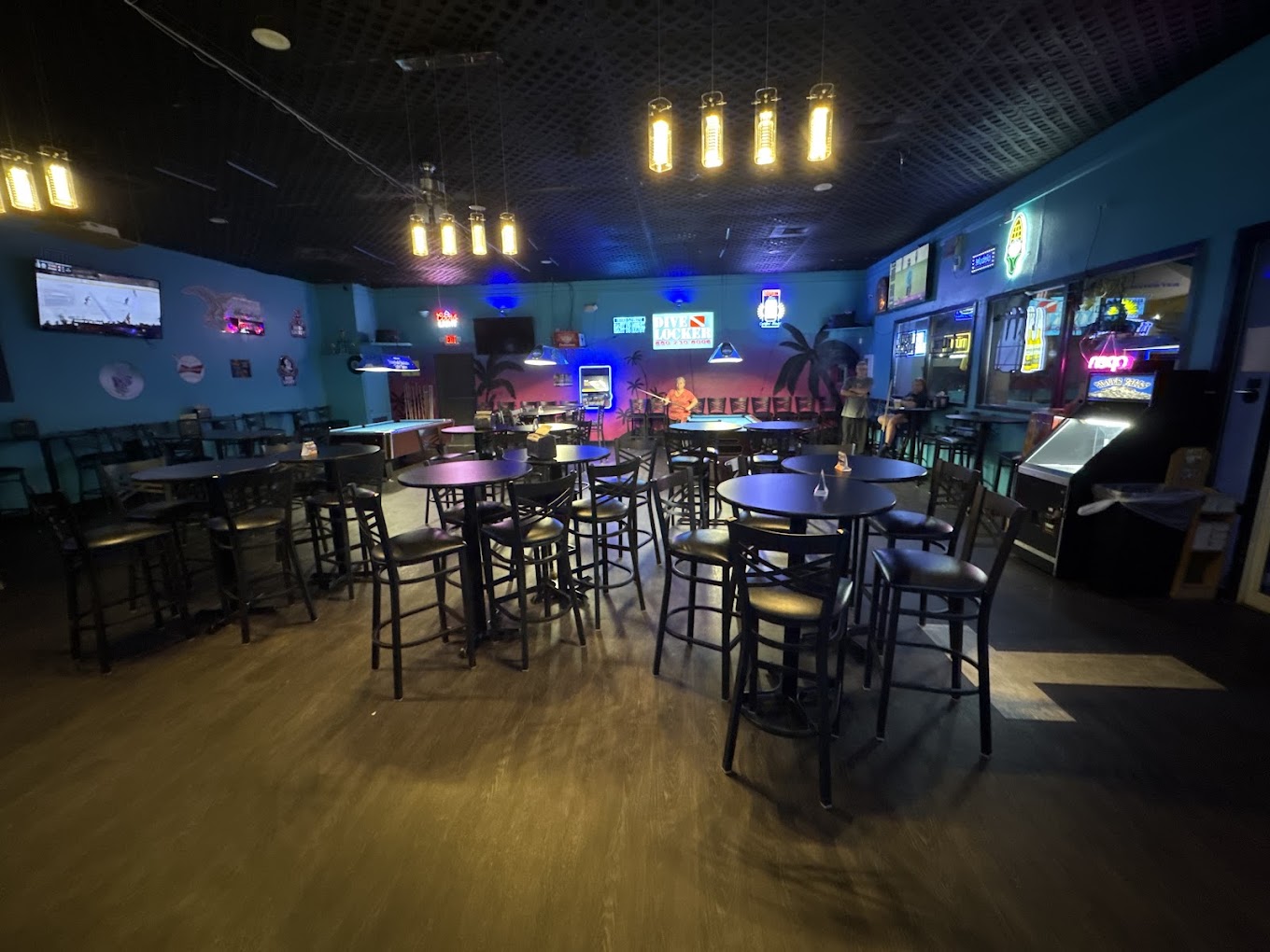 T's On Thomas interior — pool tables, blue walls, neon