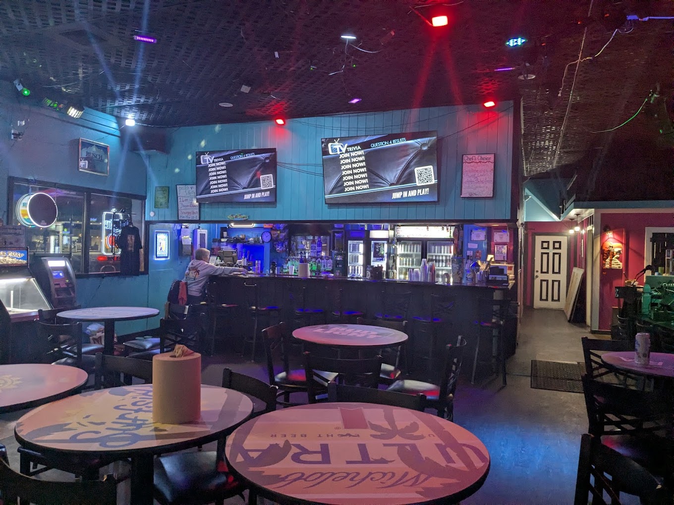 T's On Thomas interior — bar, screens, live setup